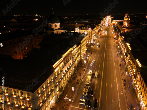 Aerial view of the bright Nevski street and Kazan Cathedral and House of the Singer company in the historical city of St. Petersburg at light night 