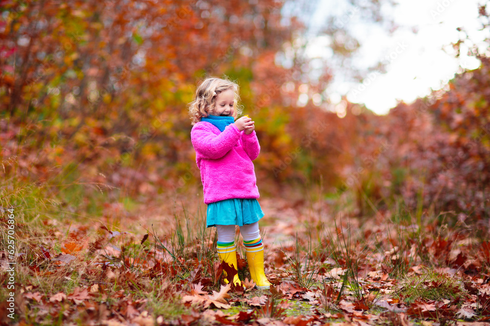 Kids play in autumn park. Children in fall forest. Kids play in autumn park. Children in fall forest.