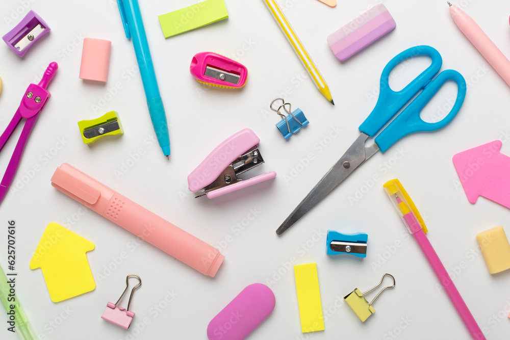 Flat lay with colorful school stationery on white backgroung, top view Flat lay with colorful school stationery on white backgroung, top view