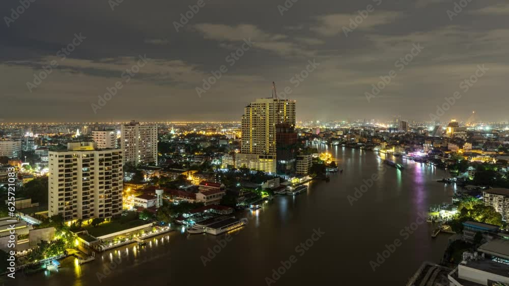 Time lapse of the Chao Phraya River and Bangkok Thailand at night with clouds overhead Time lapse of the Chao Phraya River and Bangkok Thailand at night with clouds overhead