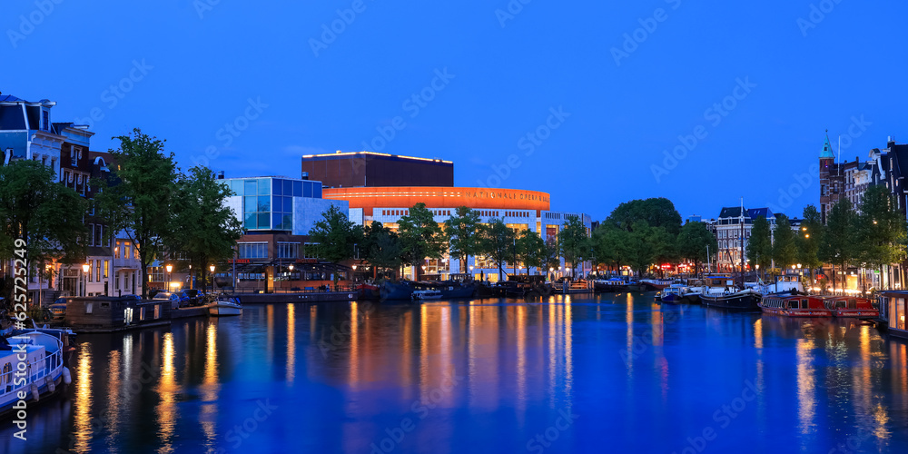Obraz premium The Dutch National Opera and Ballet housed in the Stopera building, a modern building designed by Cees Dam located in Amsterdam, Netherlands.