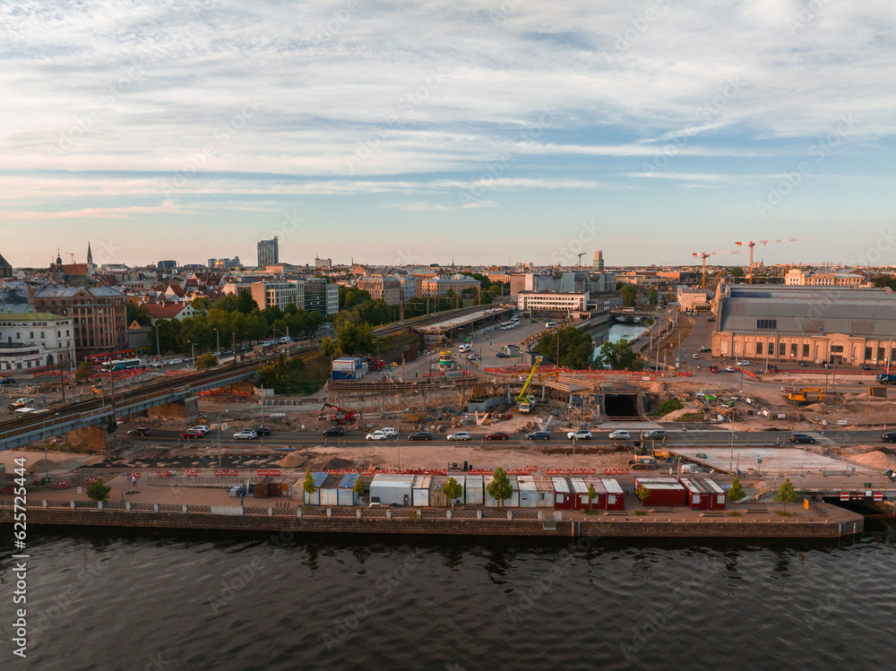 Building Rail Baltica project in the cenetr of Riga. Construction works of roads, railway and bridges in Riga.