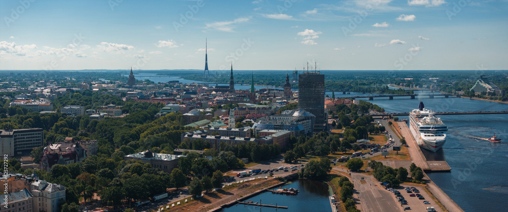 Huge cruise - Norwegian Dawn - ship docked in the center of Riga, Latvia. Aerial view of Riga city.