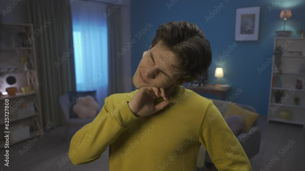 A man with a painful facial expression is massaging, rubbing, kneading his neck close up. The man felt relieved, muscle tension decreased. Incorrect posture, pain in the neck. HDR BT2020 HLG Material. A man with a painful facial expression is massaging, rubbing, kneading his neck close up. The man felt relieved, muscle tension decreased. Incorrect posture, pain in the neck. HDR BT2020 HLG Material.