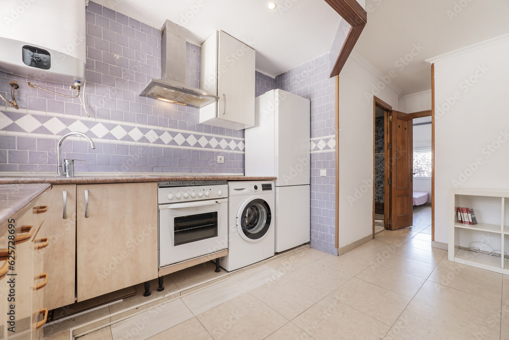 open kitchen furnished with white appliances and light open kitchen furnished with white appliances and light