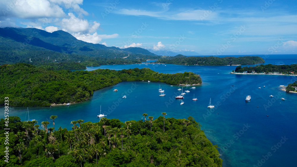 Sailing yachts in the marina. Aerial view of sailing yachts in the lagoon off the coast of a tropical island.
