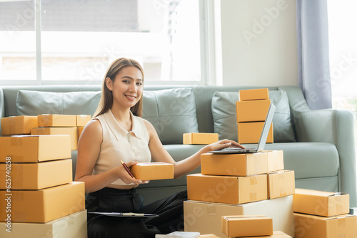 Business woman's success Sell OnlineShipping African American ParcelBusinesswoman Working at Warehouse Prepares SME Package Box for Delivery at Home Small Business OfficeOnline Sales Ideas