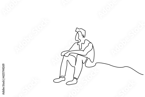 thoughtful calm sad man sitting on the floor