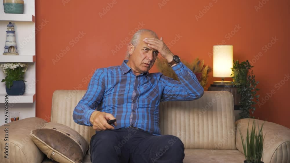 Old man watching horror movie. Old man watching horror movie.