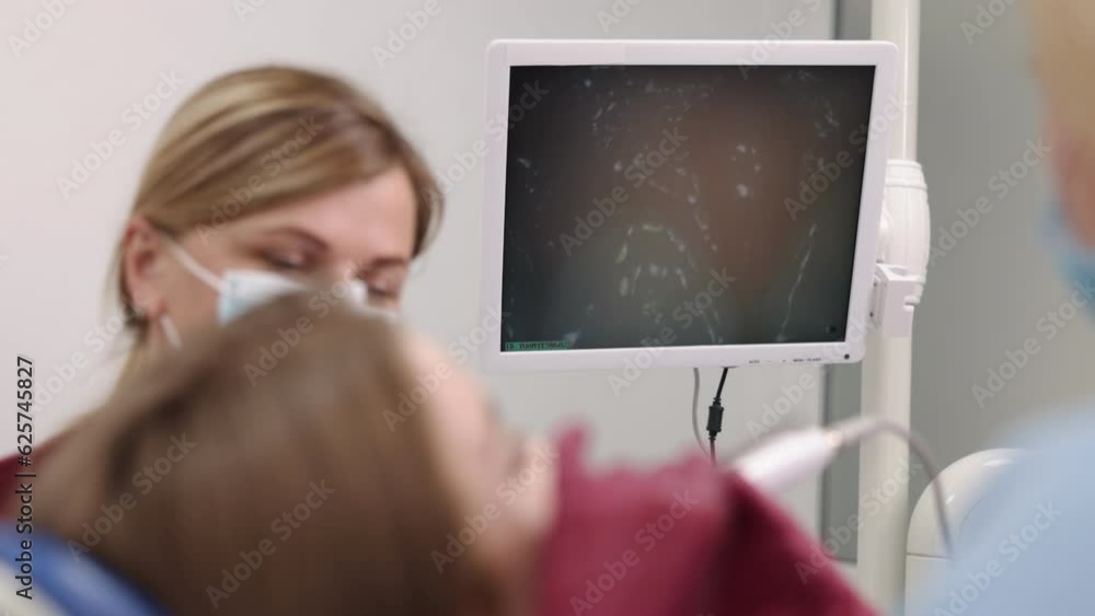 Oral health, mouth inspection, dental procedure. With intraoral camera