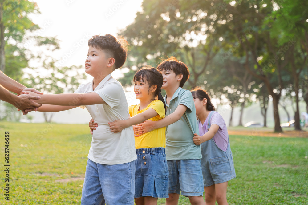 group image of cute asian children playing in the park