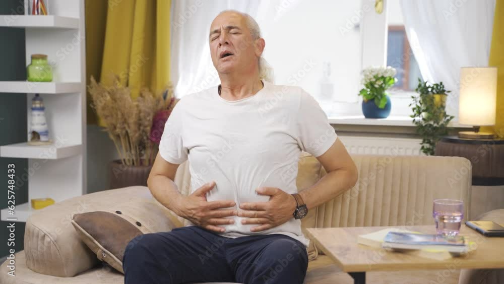 Old man experiencing stomachache. Old man experiencing stomachache.