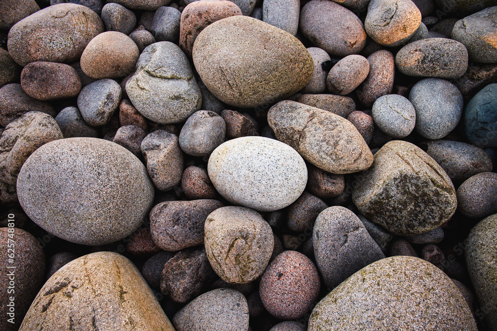 Smooth brown and grey cobblestones on a beach in Acadia, Maine Smooth brown and grey cobblestones on a beach in Acadia, Maine