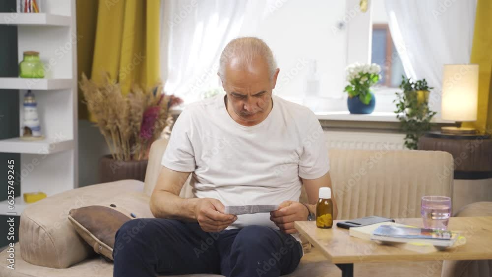 The old man reading the prospectus. The old man reading the prospectus.