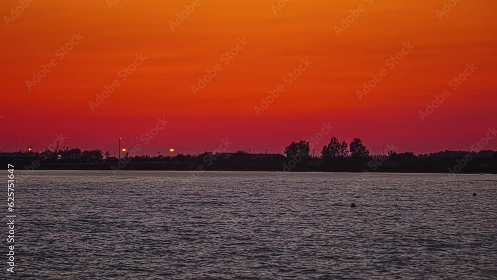 Golden hour red orange fuzzy hues darken above ocean at paphos Cyprus Golden hour red orange fuzzy hues darken above ocean at paphos Cyprus