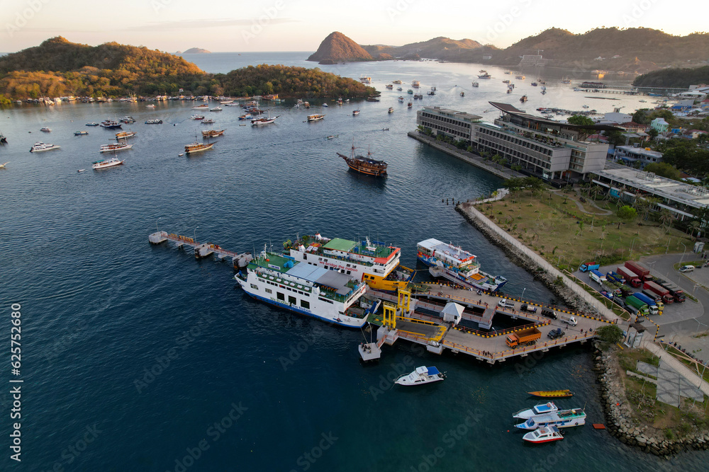 Labuan Bajo port - Rush Hour view in Labuan Bajo Harbour in the morning with Luxury Phinisi view Sailing Komodo National Park 