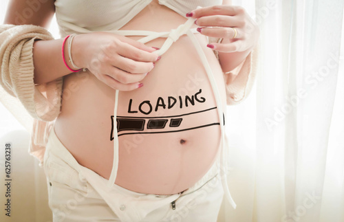pregnant woman who is about to give birth There was a download sign appearing on the stomach.