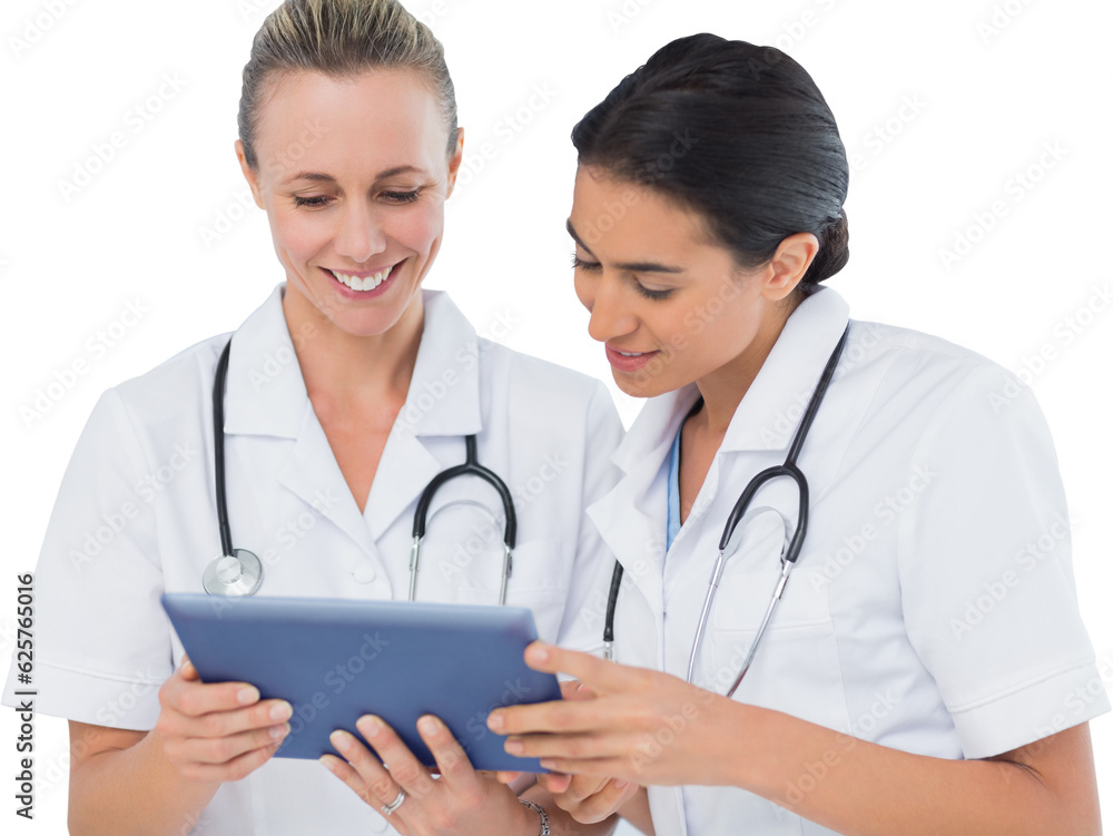 Digital png photo of happy diverse female doctors looking at tablet on transparent background Digital png photo of happy diverse female doctors looking at tablet on transparent background