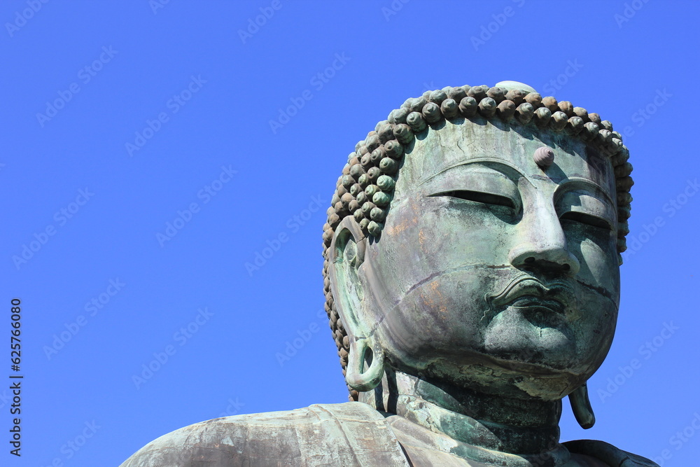 Daibutsu (Giant Buddah) located at the Kotokuin Temple in Kamakura, Japan. Daibutsu (Giant Buddah) located at the Kotokuin Temple in Kamakura, Japan.