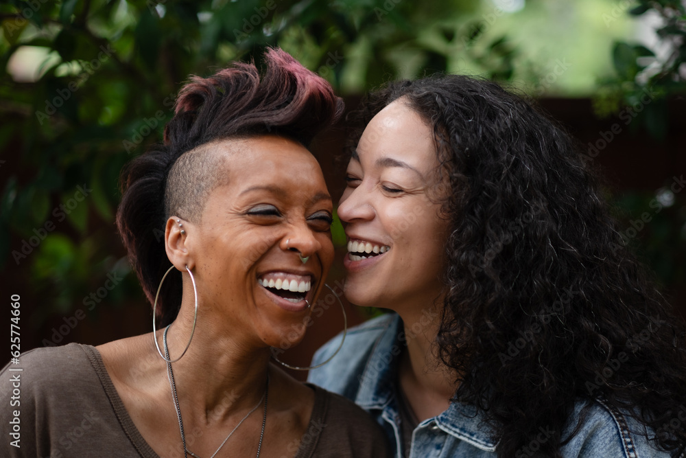 With Big Smiles As They Laugh Together A Lesbian Couple Shares An