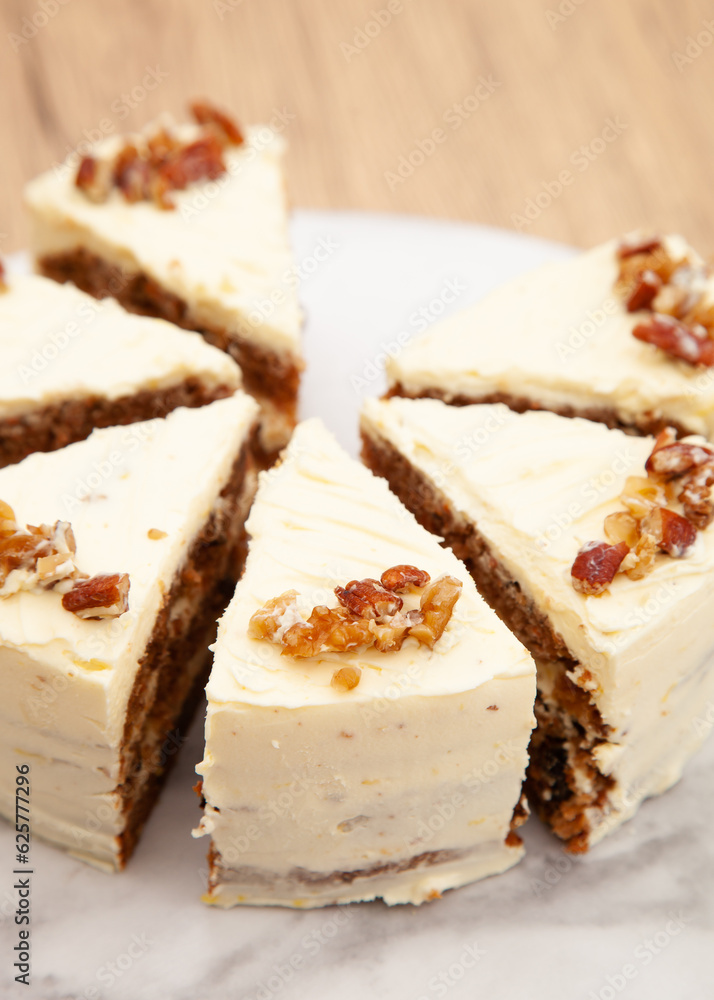 Classic carrot cake with cream cheese frosting, pecan, walnut and raisin Classic carrot cake with cream cheese frosting, pecan, walnut and raisin
