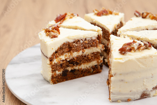 Classic carrot cake with cream cheese frosting, pecan, walnut and raisin