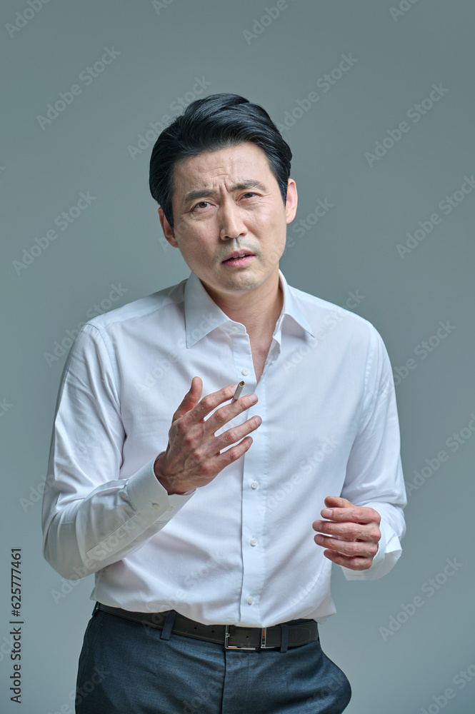 Middle-aged man struggling to quit smoking, smoking Middle-aged man struggling to quit smoking, smoking