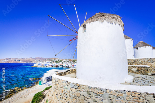 Mykonos, Greece. Little Venice, with windmills and waterfront whitewashed houses, Greek Islands. photo