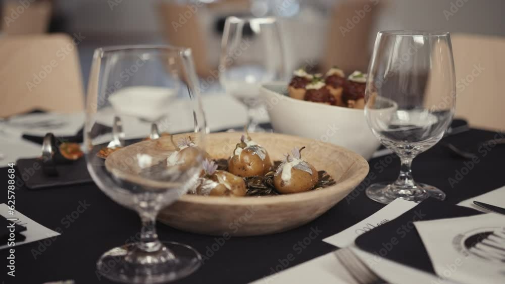 Dinner table preparation at a luxurious restaurant Dinner table preparation at a luxurious restaurant