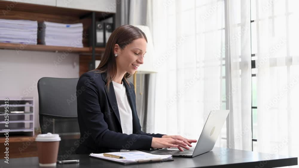 Successful Caucasian Businesswoman Analyzing Finance on Tablet and Laptop at modern Office Desk tax, report, accounting, statistics, and analytical research concept Successful Caucasian Businesswoman Analyzing Finance on Tablet and Laptop at modern Office Desk tax, report, accounting, statistics, and analytical research concept