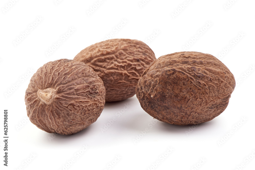 Fresh Nutmeg. Whole nuts, close-up, isolated on white background. Fresh Nutmeg. Whole nuts, close-up, isolated on white background.