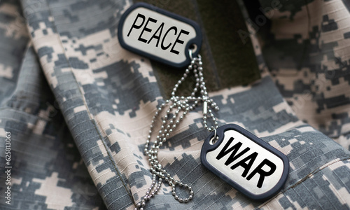 army blank, dog tag with text war peace on the khaki texture background. military concept