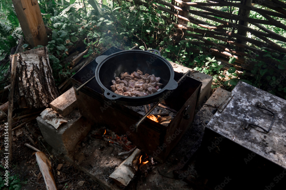 Cooking over a campfire. Summer vacation. Cooking over a campfire. Summer vacation.