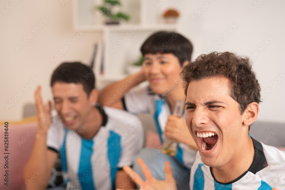 Fototapeta premium Friends shouting while watching penalties of an argentina match