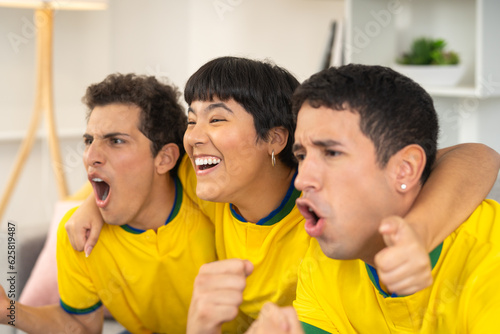 Friends celebrating brazil's goal