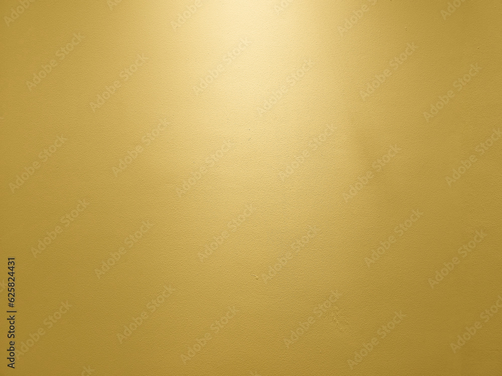 Fototapeta premium Gold Wall with Light from the Top Background.