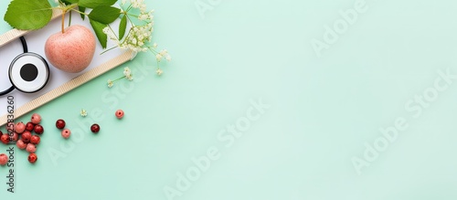 Photo of fresh fruits and vegetables on a vibrant green background with copy space