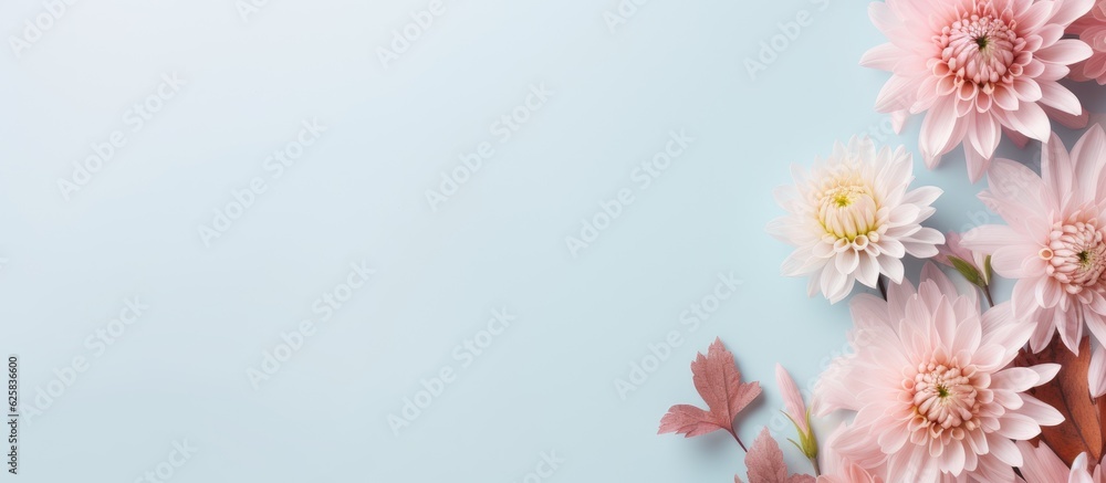 Photo of a vibrant bouquet of pink flowers against a serene blue backdrop with copy space
