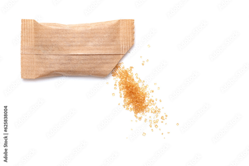 Spilled cane sugar from a small paper sachet. Preparation for