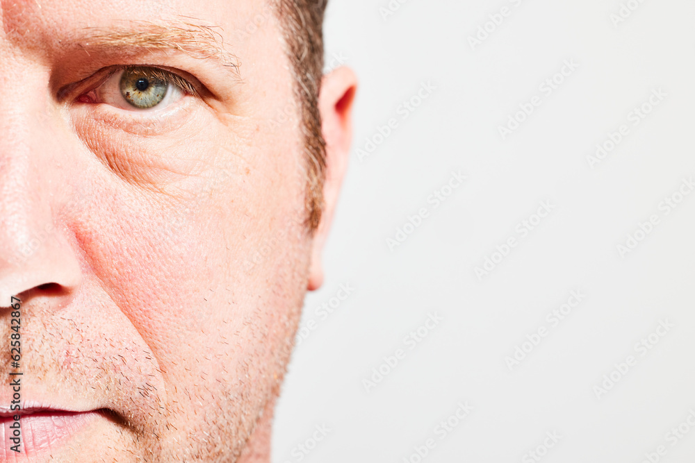 Obraz premium Closeup of male face in half