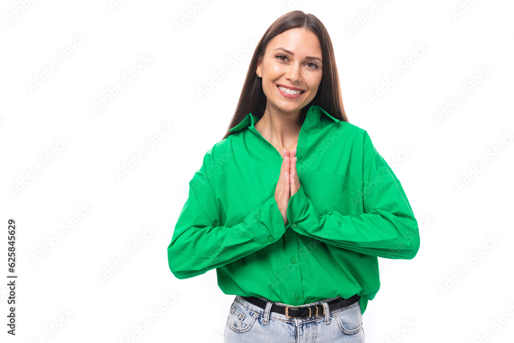 Fototapeta premium friendly cute young brown-haired female model with brown eyes in a green shirt