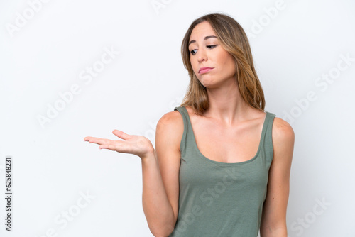 Wallpaper Mural Young caucasian woman isolated on white background holding copyspace with doubts Torontodigital.ca