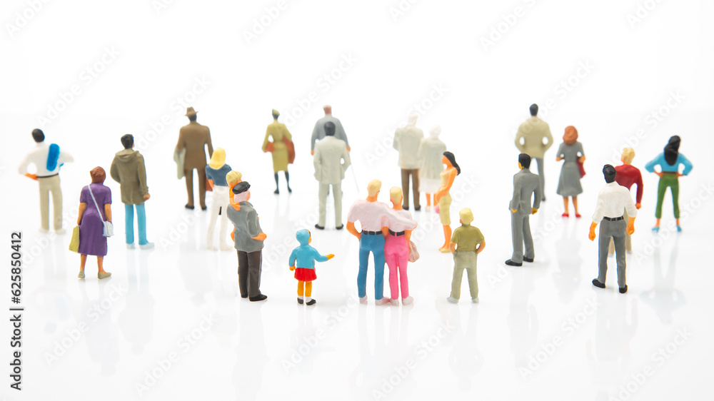 miniature people. different people stand on a white background. people communicate with each other. communication of society of different generations miniature people. different people stand on a white background. people communicate with each other. communication of society of different generations
