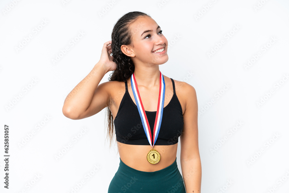 Young sport woman with medals isolated on white background thinking an idea Young sport woman with medals isolated on white background thinking an idea