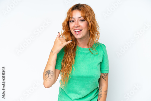 Young caucasian woman isolated on white background making phone gesture. Call me back sign