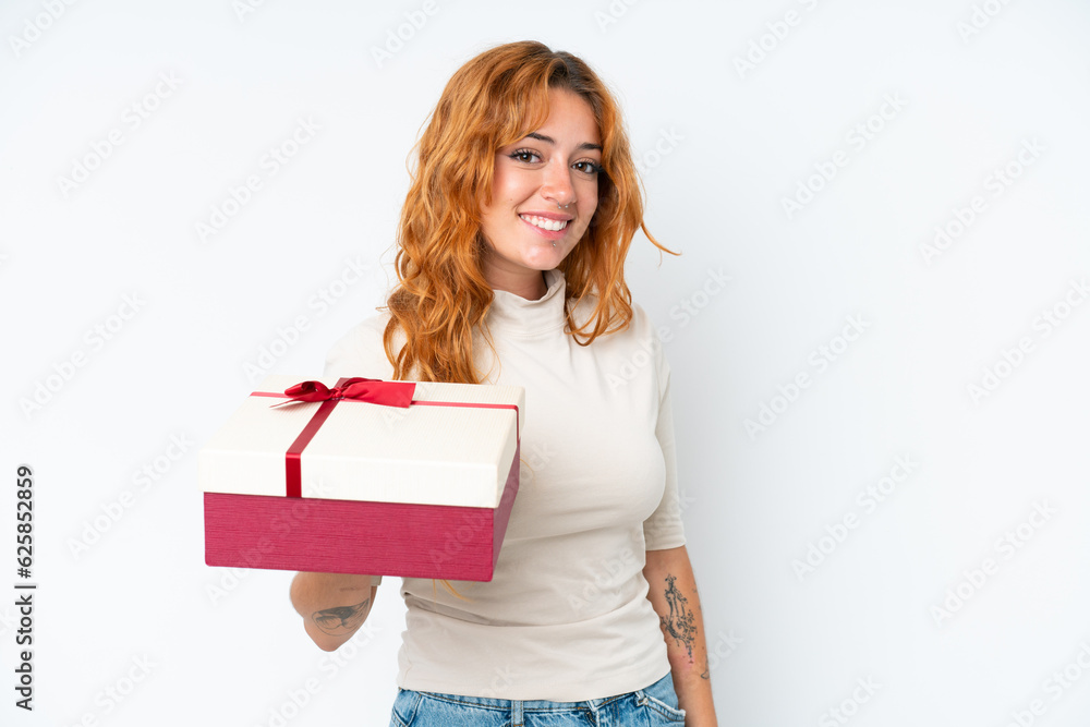 Young caucasian woman holding a gift iso0lated on white background smiling a lot Young caucasian woman holding a gift iso0lated on white background smiling a lot