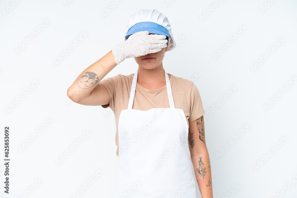 Fishmonger wearing an apron and holding a raw fish isolated on white background covering eyes by hands. Do not want to see something Fishmonger wearing an apron and holding a raw fish isolated on white background covering eyes by hands. Do not want to see something