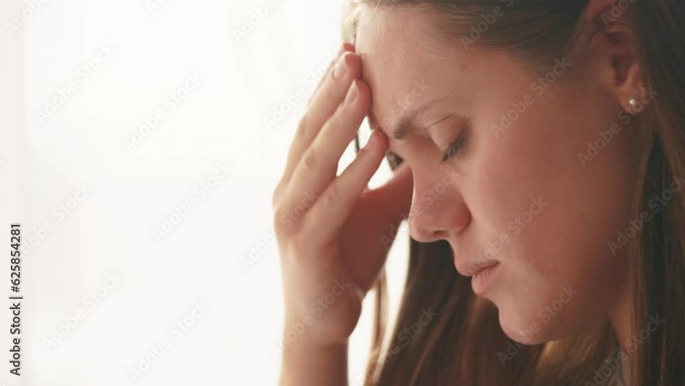 girl has a headache. girl rubs whiskey headache close-up. migraine health medicine concept. sick unhealthy woman suffering from dizziness overloaded at work. lifestyle migraine concept girl has a headache. girl rubs whiskey headache close-up. migraine health medicine concept. sick unhealthy woman suffering from dizziness overloaded at work. lifestyle migraine concept