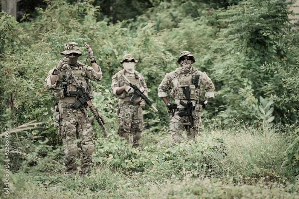 United States Army ranger during the military operation. Professional marine soldiers training with weapon on a military range.