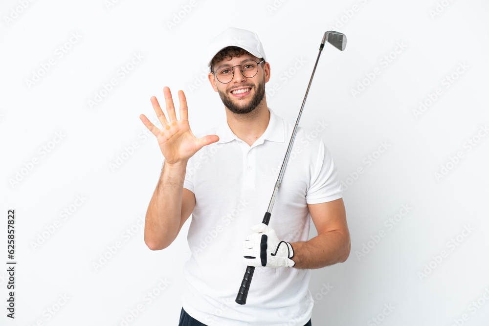 Handsome young man playing golf isolated on white background counting five with fingers Handsome young man playing golf isolated on white background counting five with fingers